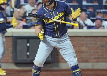 Rhys Hoskins of the Milwaukee Brewers reacts after striking out swinging.