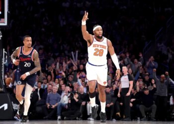 - New York Knicks forward Guerschon Yabusele #28 reacts after he hits a three-point shot over LA Clippers forward John Collins #20 during the fourth quarter.