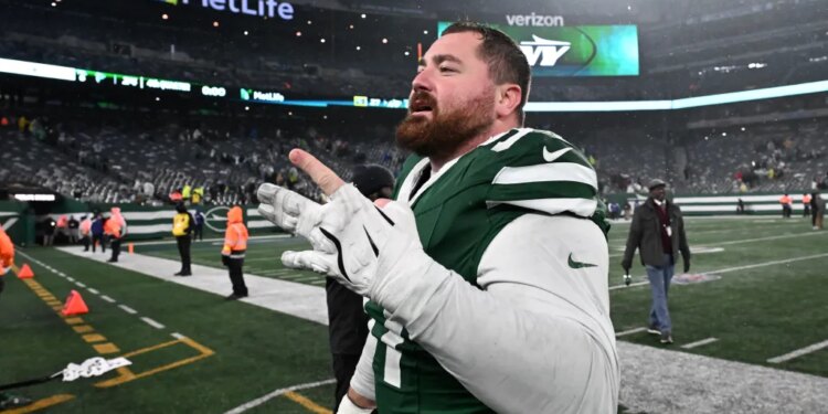 Jets defensive tackle Harrison Phillips reacts on the field after the Jets beat the Atlanta Falcons 27-24.
