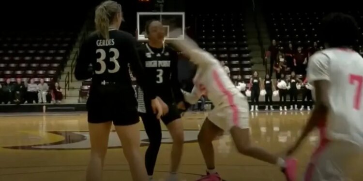 Another view of Winthrop's Tocarra Johnson (25) punching High Point's Nevaeh Zavala (3) during the fourth quarter on Feb. 4, 2026.