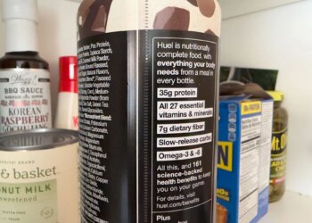 Close up of a Huel bottle’s nutritional label that says ‘Huel is nutritionally complete food with everything your body needs from a meal in every bottle.’ It then lists the macronutrients and says ‘All this, and 161 science-backed health benefits to keep you on your game.’
