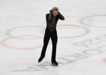 Ilia Malinin holding his head during the men's free skate program at the 2026 Winter Olympics.