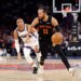 New York Knicks guard Jalen Brunson drives down court as Sacramento Kings guard Russell Westbrook gives chase.
