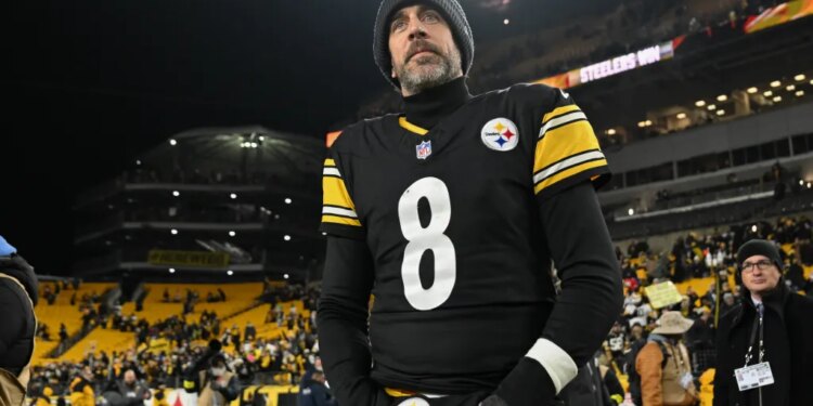 Pittsburgh Steelers quarterback Aaron Rodgers on the field after a game.