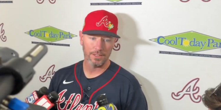 Baseball player Josh Donaldson speaking into multiple microphones.