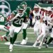 Jets running back Breece Hall (20) runs the ball during a game against the New England Patriots.