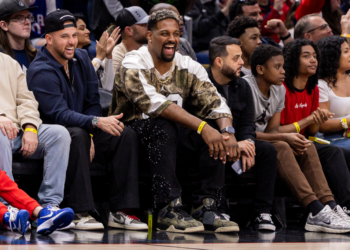 New Orleans Saints defensive end Cam Jordan watching a basketball game.