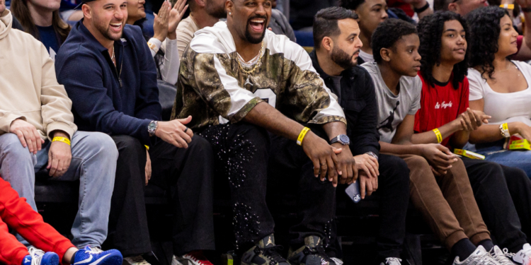 New Orleans Saints defensive end Cam Jordan watching a basketball game.