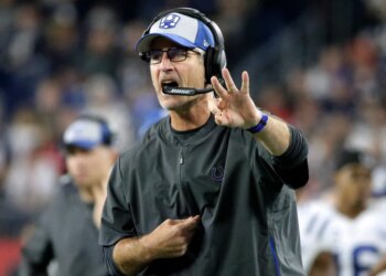 Indianapolis Colts head coach Frank Reich signaling from the sideline.