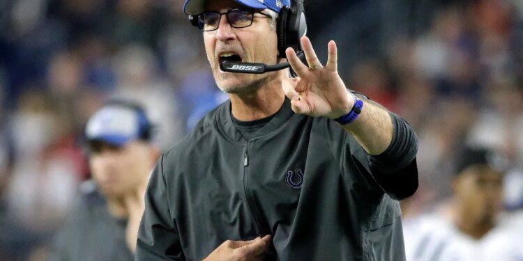 Indianapolis Colts head coach Frank Reich signaling from the sideline.