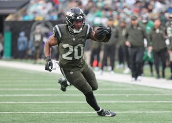 New York Jets running back Breece Hall #20 runs the ball during the fourth quarter.
