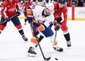 Islanders left wing Jonathan Drouin skates with the puck in front of Capitals center Aliaksei Protas during the second period on Monday, Feb. 2, 2026, in Washington.