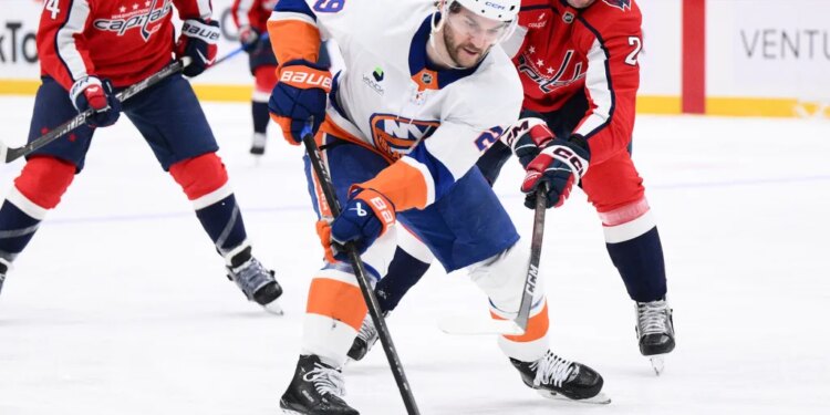 Islanders left wing Jonathan Drouin skates with the puck in front of Capitals center Aliaksei Protas during the second period on Monday, Feb. 2, 2026, in Washington.