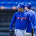 Juan Soto in a Mets helmet and blue Mets hoodie during spring training.
