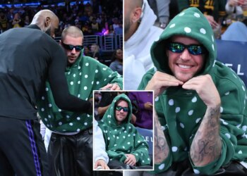 Justin Bieber cheers LeBron James courtside at Lakers game