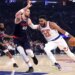 New York Knicks center Karl-Anthony Towns drives to the basket as LA Clippers center Ivica Zubac defends during the first quarter.