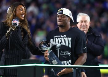 Seattle Seahawks running back Kenneth Walker III celebrates with the Vince Lombardi trophy after defeating the New England Patriots in Super Bowl LX.