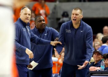Kentucky head coach Mark Pope reacting to a call during a basketball game.