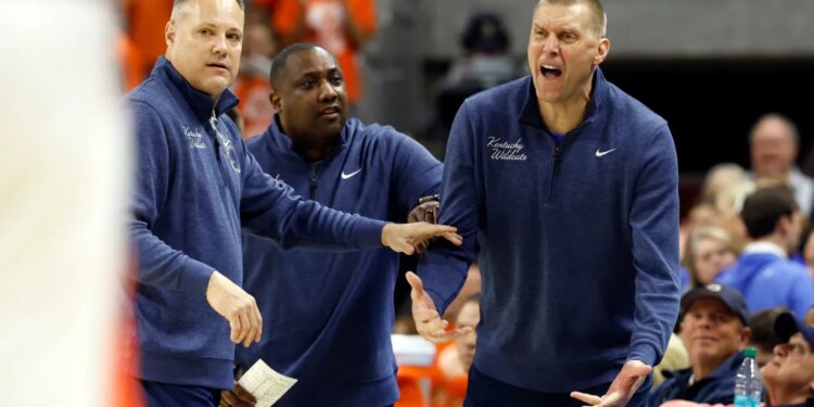 Kentucky head coach Mark Pope reacting to a call during a basketball game.