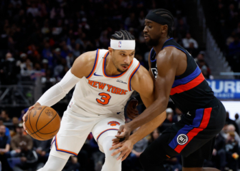 Josh Hart, who later exited with an ankle injury, looks to make a move on Caris LeVert during the Knicks' 118-80 blowout loss to the Pistons on Feb. 6, 2026 in Detroit.