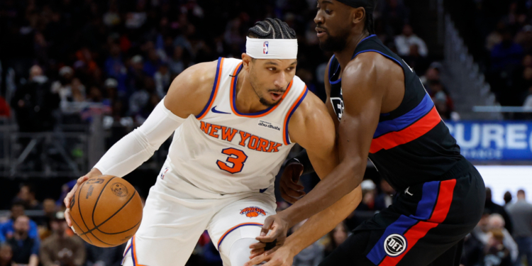 Josh Hart, who later exited with an ankle injury, looks to make a move on Caris LeVert during the Knicks' 118-80 blowout loss to the Pistons on Feb. 6, 2026 in Detroit.