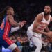 New York Knicks guard Mikal Bridges (25) looks to the basket against Detroit Pistons guard Daniss Jenkins (24).
