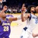 Dallas Mavericks forward Marvin Bagley III holding the ball away from Los Angeles Lakers forward Rui Hachimura.