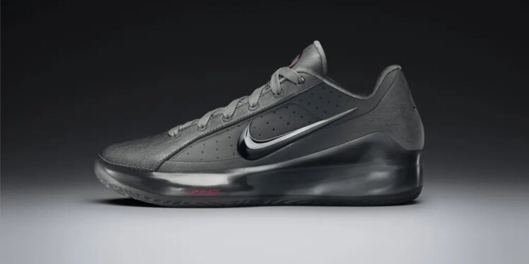 LeBron NXXT Gen by JuJu Watkins basketball shoe in dark gray with a reflective silver Nike swoosh.