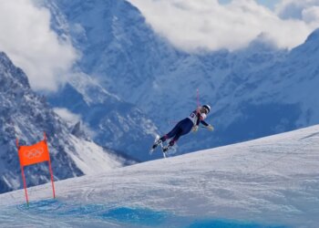 Lindsey Vonn crashing during an alpine ski downhill race at the 2026 Winter Olympics.
