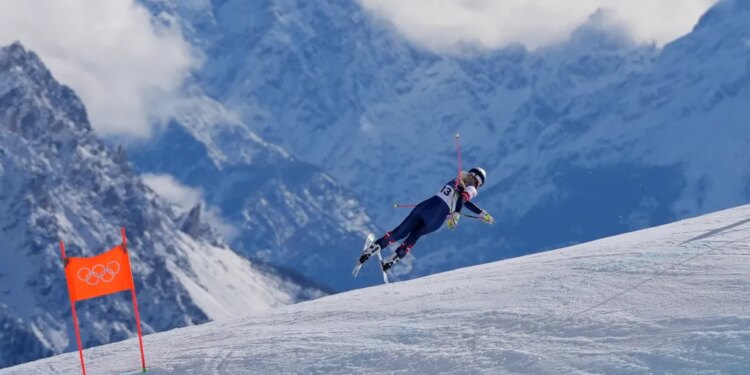 Lindsey Vonn crashing during an alpine ski downhill race at the 2026 Winter Olympics.