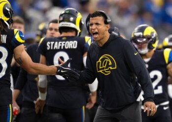 Los Angeles Rams pass game coordinator Nate Scheelhaase gesturing during a football game.