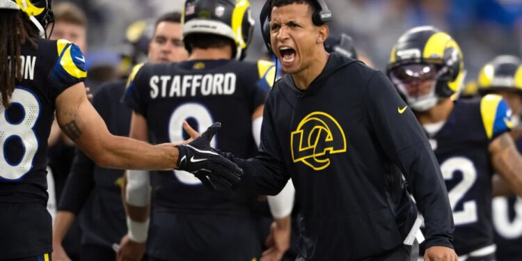 Los Angeles Rams pass game coordinator Nate Scheelhaase gesturing during a football game.