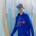 New York Mets pitcher Luke Weaver in a blue hoodie and orange cap.