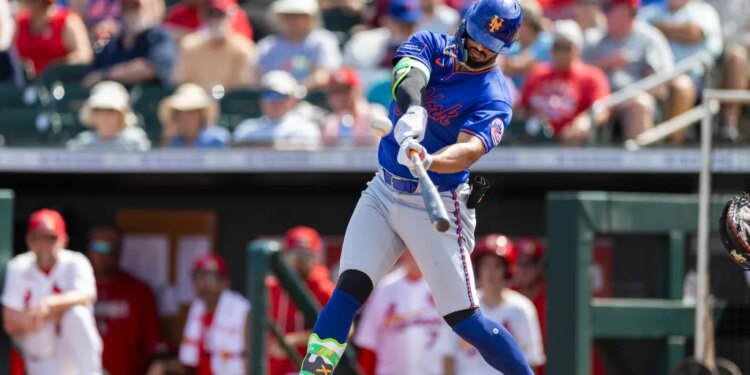 MJ Melendez of the New York Mets hits a solo home run against the St. Louis Cardinals during Spring Training.