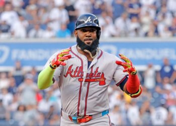 Marcell Ozuna in a baseball uniform with a light blue and red Atlanta Braves jersey.