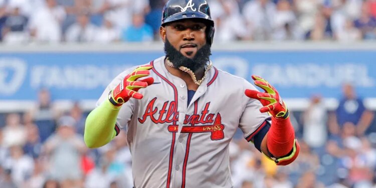 Marcell Ozuna in a baseball uniform with a light blue and red Atlanta Braves jersey.