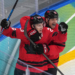 Canada's Nathan MacKinnon (29) celebrates with Sam Reinhart (13) after MacKinnon scored a goal against Finland during the third period of a men's ice hockey semifinal game at the 2026 Winter Olympics in Milan, Italy, Friday, Feb. 20, 2026. (AP Photo/Carolyn Kaster)