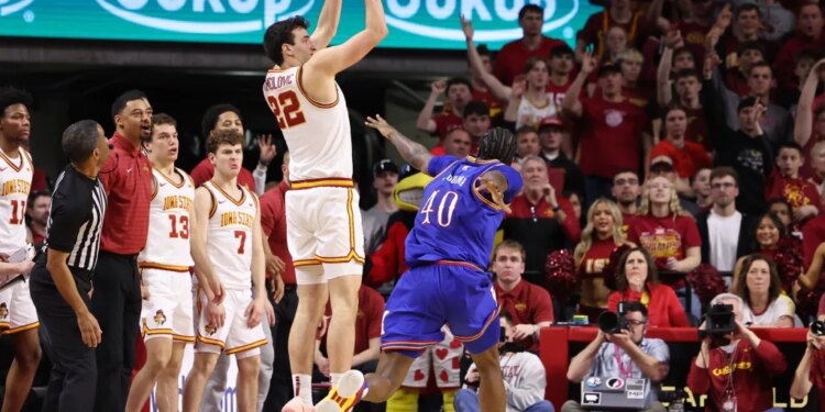 Iowa State Cyclones forward Milan Momcilovic (22) shoots over Kansas Jayhawks forward Flory Bidunga (40).