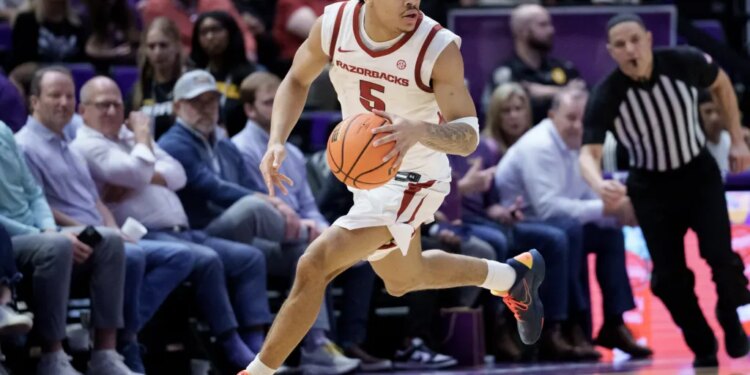 Arkansas Razorbacks guard Darius Acuff Jr. dribbles the basketball during the second half against the LSU Tigers.