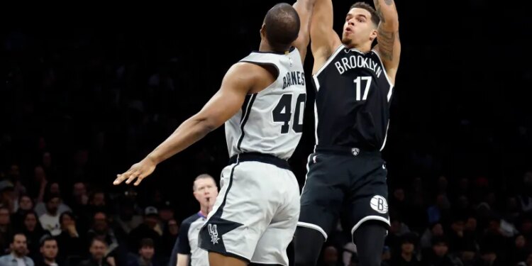 Brooklyn Nets Michael Porter Jr. shooting over San Antonio Spurs Harrison Barnes.