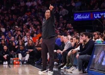 Mike Brown of the New York Knicks reacts on the baseline.