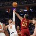 New York Knicks guard Jalen Brunson goes up for a shot as Cleveland Cavaliers forward Jaylon Tyson.