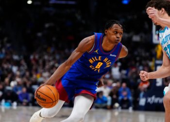 Denver Nuggets guard Peyton Watson (8) drives against Charlotte Hornets forward Tidjane Salaun (31) in the second half at Ball Arena.