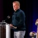 NFL Commissioner Roger Goodell speaks at a news conference next to the Vince Lombardi Trophy.