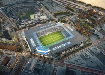 Illustration of an aerial view of Etihad Park Stadium and the surrounding city buildings.