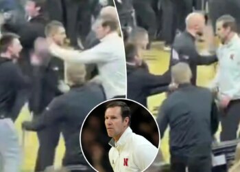Nebraska's Fred Hoiberg smacks phone out of Iowa fan's hand