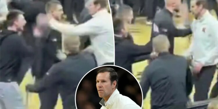 Nebraska's Fred Hoiberg smacks phone out of Iowa fan's hand