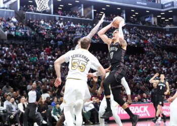 Michael Porter Jr. of the Brooklyn Nets shoots the ball in a basketball game against the Boston Celtics.