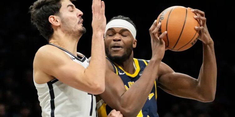 Indiana's Jarace Walker, who scored a game-high 23 points, looks to make a move on Ben Saraf during the Nets' 115-110 loss to the Pacers on Feb. 11, 2026 at Barclays Center.