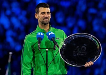 Novak Djokovic of Serbia with his finalist trophy after the final of the mens singles against Carlos Alcaraz of Spain at the Australian Open at Rod Laver Arena in Melbourne Park.